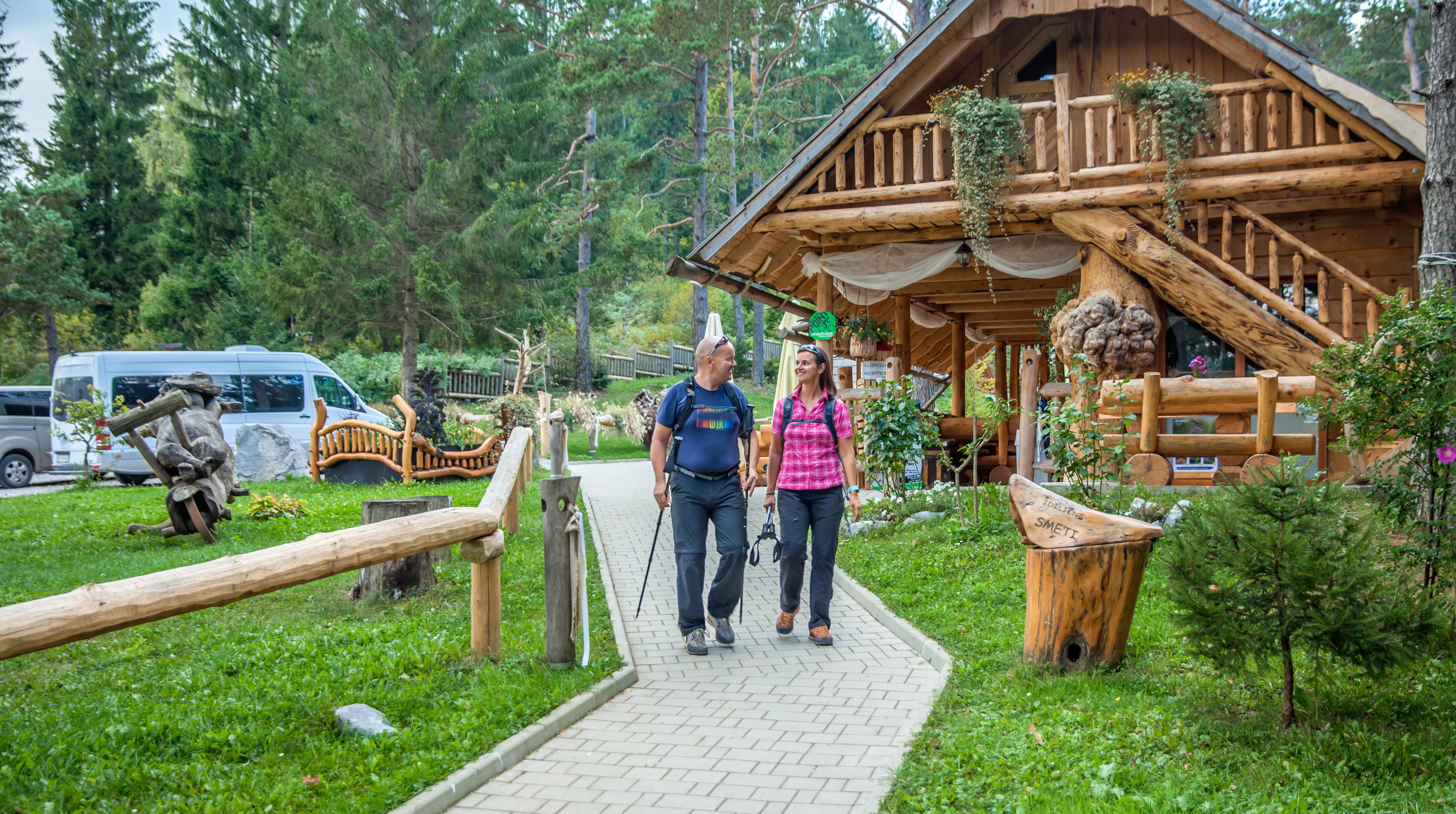 Tourists Taking A Stroll Around Hija Glamping Lake Bloke At Nova Vas, Slovenia Tourists Taking A Stroll Around Hija Glamping Lake Bloke At Nova Vas, Slovenia